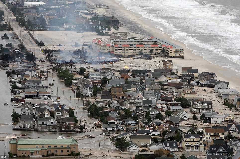 On fire: This photo from the New Jersey Governor's Office shows damage north of Seaside, New Jersey, on Tuesday after Superstorm Sandy made landfall
