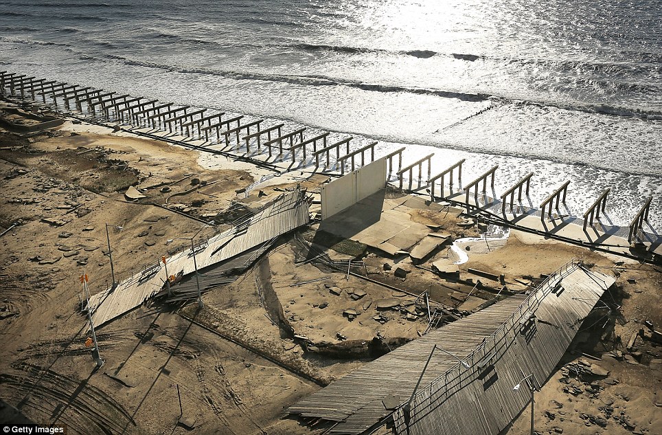 All that's left: The foundations to the historic Rockaway boardwalk are all that remain after it was washed away during Superstorm Sandy in Brooklyn, New York 