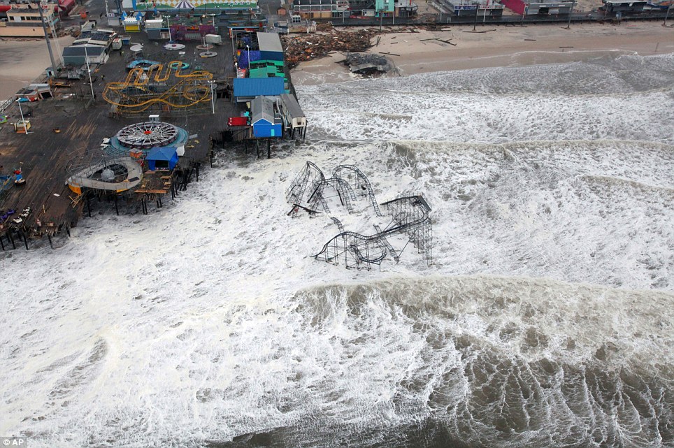 No play: This US Air Force photo shows an aerial view of the rollercoaster from the Seaside Heights amusement park on the New Jersey shore submerged in surf